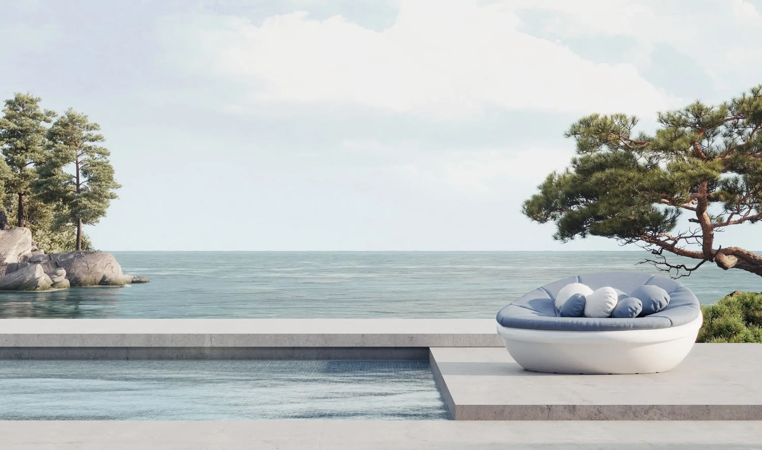 Die LAGOON Lounge der Solpuri Terrassenmöbel neben einem Pool am Meer.