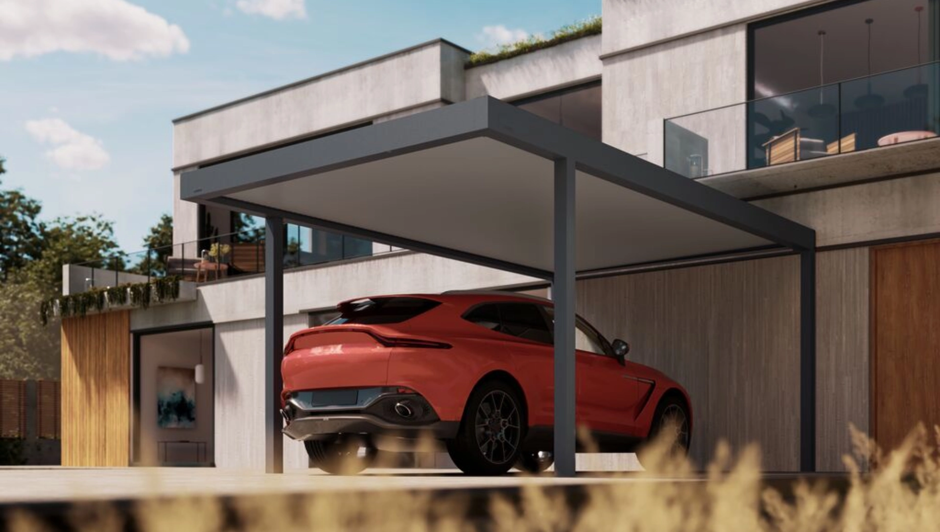 Ein rotes Auto parkt unter dem Carport Brustor B910 in dunkler Gestellfarbe bei Tag.